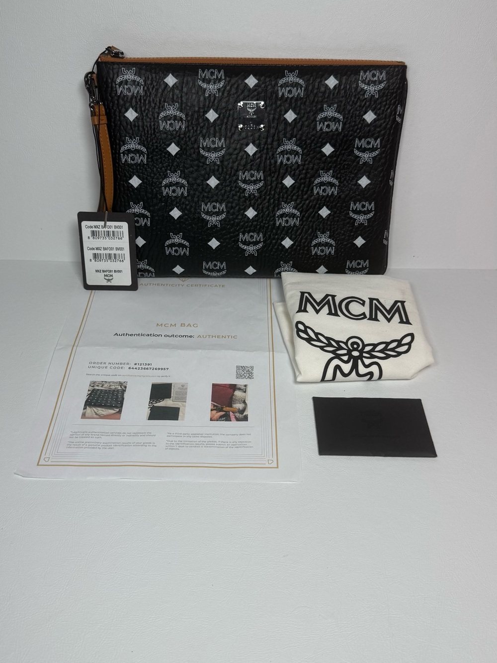MCM Black Visetos Monogram Leather Zip Clutch Wristlet Pouch with Tan Trim